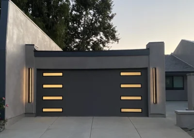 Clopay Modern Steel with Contemporary Windows 9208 in Lustra Charcoal with Frosted Slim Windows GSSG Flush