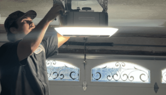 Technician performing Calabasas garage door service inspection