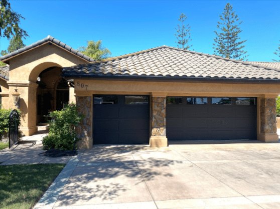 A garage door and garage door openers specialist in Saugus is installing custom blue torsion springs for Archway Garage Doors to ensure smooth operation.